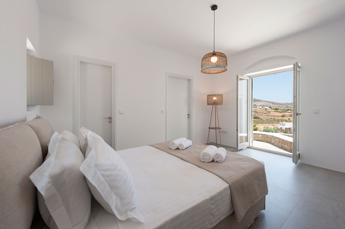 Bedroom with view in Ninemia Villas in Paros